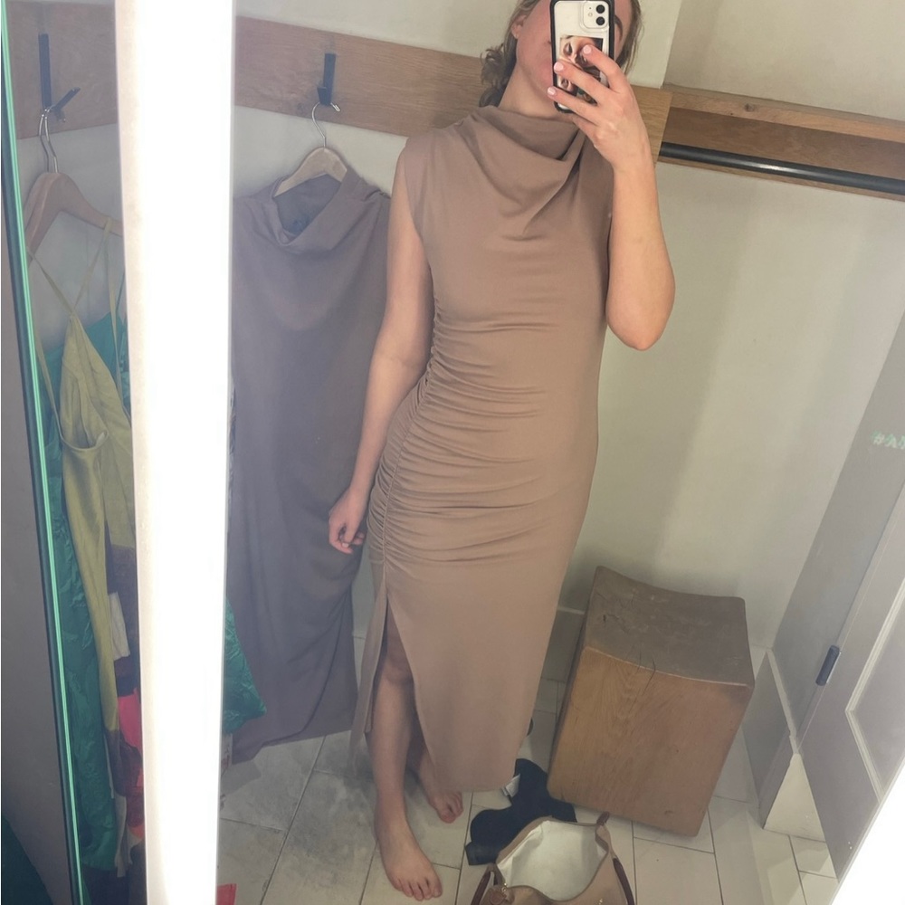 Size medium Anthropologie beige, ruched dress with slit.